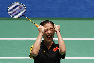 China's Wang Shixian celebrates her win over compatriot Wang Xin during the badminton women's singles final at the 16th Asian Games in Guangzhou